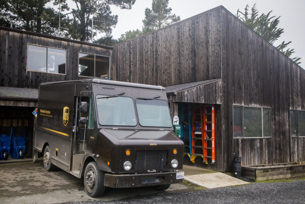 A UPS truck in front of Sea Ranch Building Supply.
